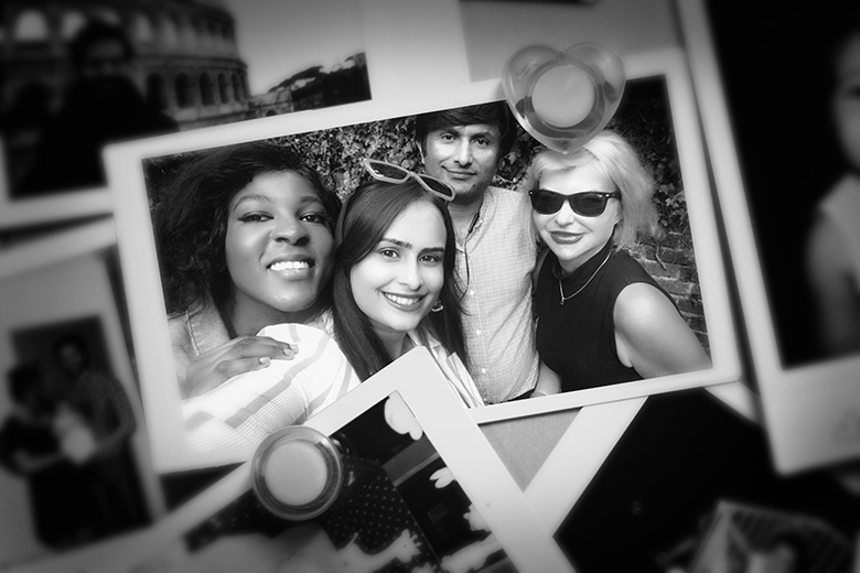 A photo of Agnieszka Piotrowska and her doctoral students Charmaine Dambuza, Priyanka Singh and Babar Hussain, added to a wall of other photographs.