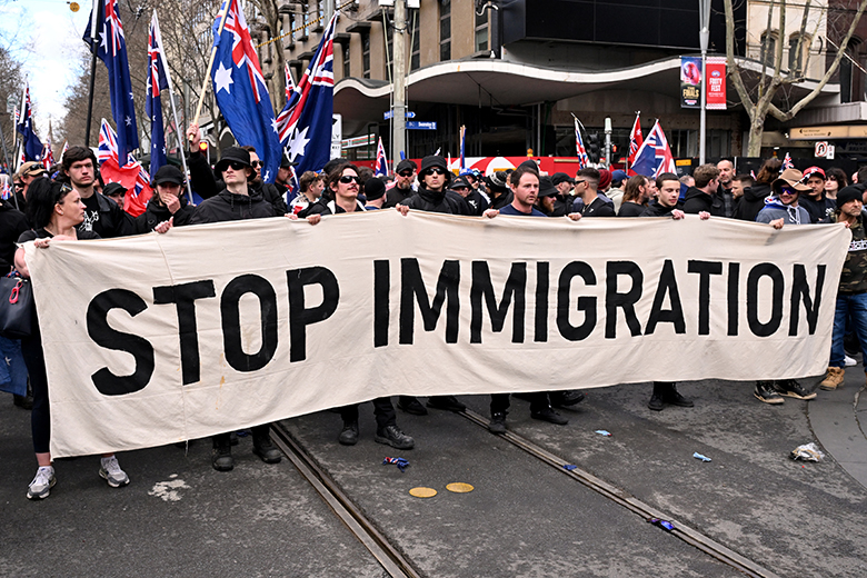 Protesters hold a banner during a "March for Australia" anti-immigration rally in Melbourne on 31 August, 2025. Protesters hold a banner during a "March for Australia" anti-immigration rally in Melbourne on 31 August, 2025.