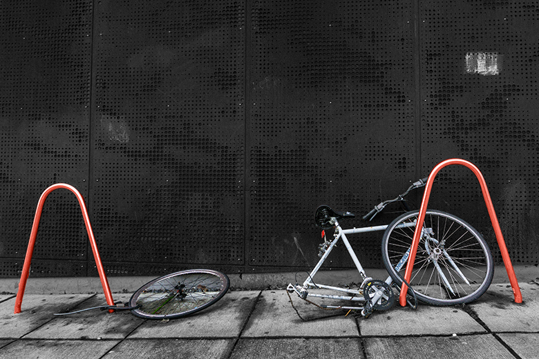 A bike missing a wheel, and a wheel missing a bike, locked to railings. To illustrate that teaching-only contracts can break the mutually supportive and reinforcing relationship between research and teaching. A bike missing a wheel, and a wheel missing a bike, locked to railings. To illustrate that teaching-only contracts can break the mutually supportive and reinforcing relationship between research and teaching.