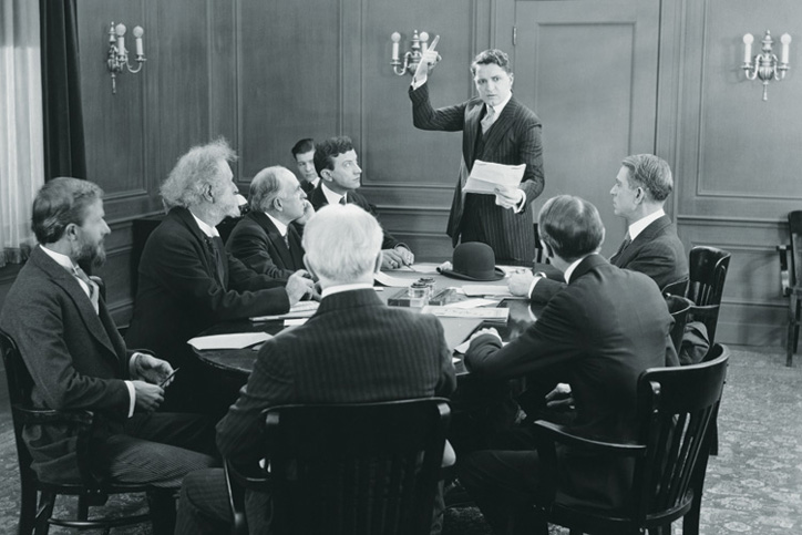Business people in boardroom meeting (black and white)