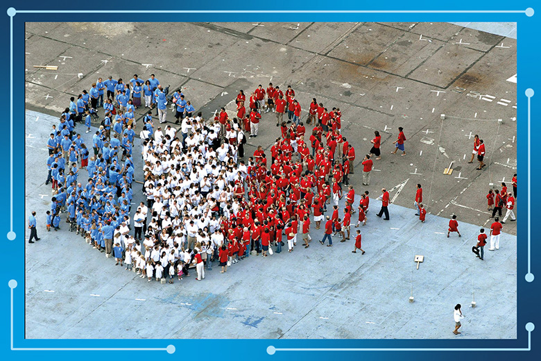 A crowd forms a blue, white and red heart -the colours of the French national flag. To illustrate the creation of mega-universities in France. A crowd forms a blue, white and red heart -the colours of the French national flag. To illustrate the creation of mega-universities in France.