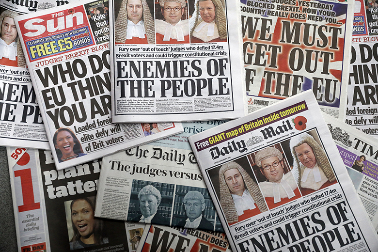 Copies of British national newspapers, tabloids and broadsheets, carry the story of the High Court battle over Article 50 on their front pages on Friday 4 November 2016. The Daily Mail headline reads “Enemies of the people”.
