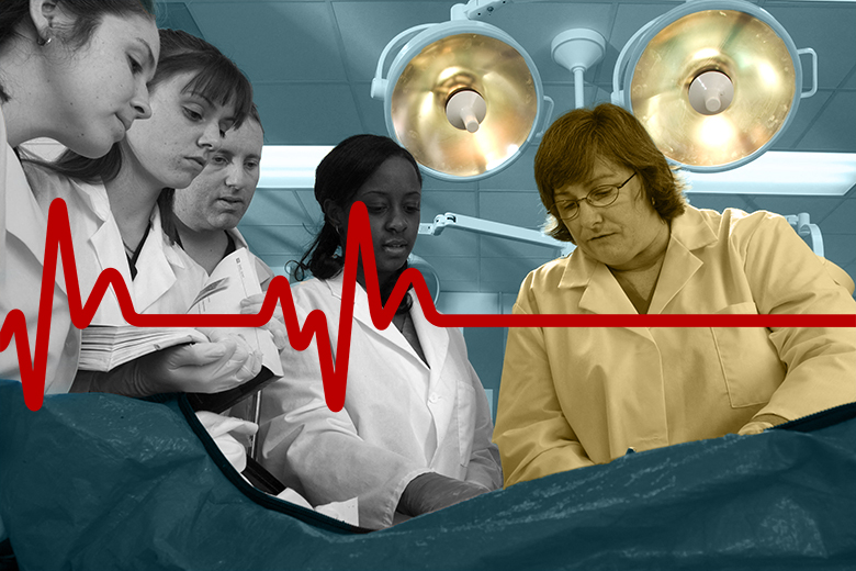 Medical students with a teacher and a flatlining heartbeat. To illustrate that there is a lack of clinical academics to meet the demand.