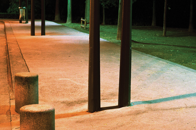 Empty pavement lit by street lights