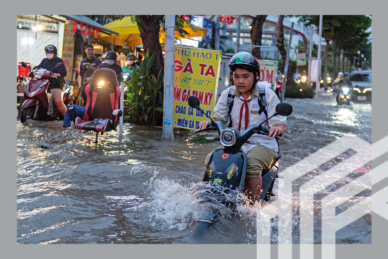 People ride motorbikes on a street as water levels reach the annual peak on 6 November, 2025 in Ho Chi Minh City, Vietnam. The city is one of the world’s fastest-sinking coastal cities and has seen worsening flooding due to climate change. People ride motorbikes on a street as water levels reach the annual peak on 6 November, 2025 in Ho Chi Minh City, Vietnam. The city is one of the world’s fastest-sinking coastal cities and has seen worsening flooding due to climate change.
