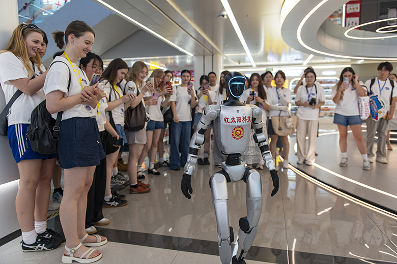 Chinese and foreign university students interact with robots at the Yiwu Global Digital Trade Center on 13 July, 2026 in Yiwu, Zhejiang Province of China. To illustrate the attraction of Asian countries with very advanced innovation economies. Chinese and foreign university students interact with robots at the Yiwu Global Digital Trade Center on 13 July, 2026 in Yiwu, Zhejiang Province of China. To illustrate the attraction of Asian countries with very advanced innovation economies.
