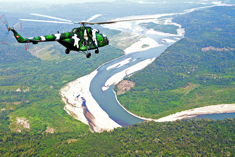 Peruvian Army helicopters overfly the VRAEM river valley area, one of the largest coca production basins in the world Peruvian Army helicopters overfly the VRAEM river valley area, one of the largest coca production basins in the world