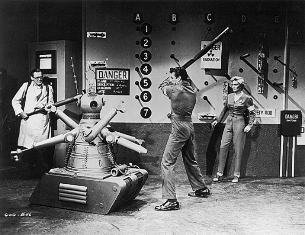 A man battles a killer robot, illustrating AI scepticism A man battles a killer robot, illustrating AI scepticism