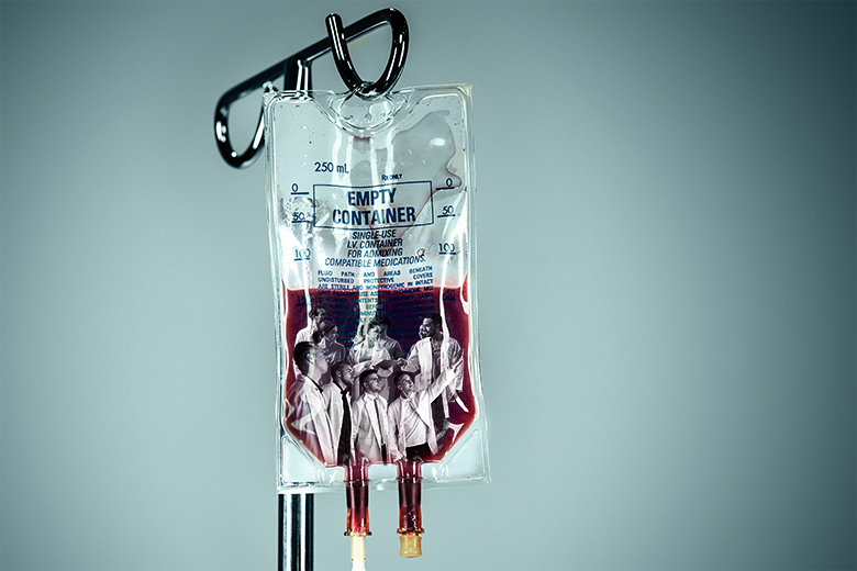Medical students in a bag of blood. To illustrate a bottleneck in the NHS for offering medical graduates training and jobs.
