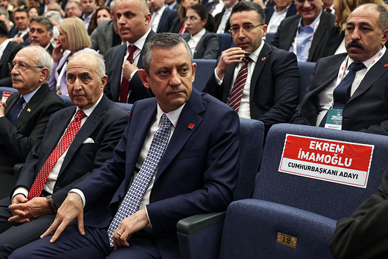 Özgür Özel (C), leader of Turkey’s main opposition Republican People’s Party (CHP), sits next to the empty chair prepared for Istanbul’s jailed mayor Ekrem İmamoğlu during an extraordinary congress of the party on 6 April 2025 in Ankara. Özgür Özel (C), leader of Turkey’s main opposition Republican People’s Party (CHP), sits next to the empty chair prepared for Istanbul’s jailed mayor Ekrem İmamoğlu during an extraordinary congress of the party on 6 April 2025 in Ankara.
