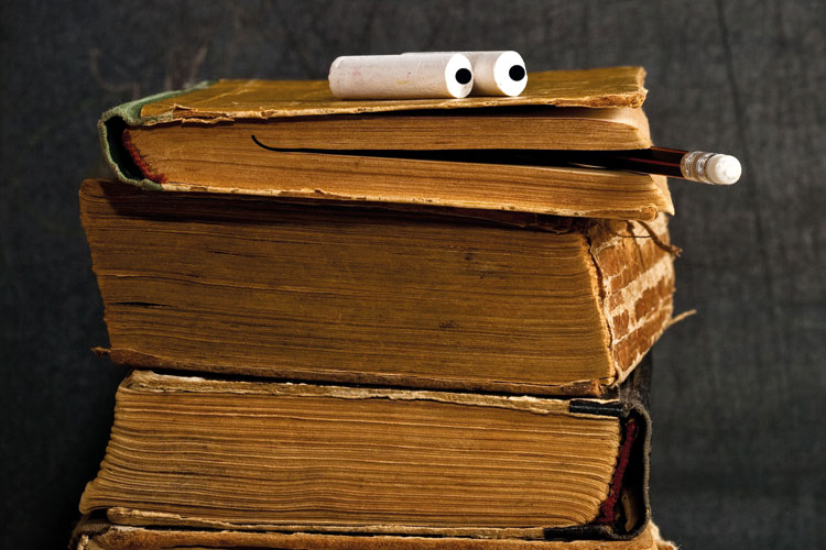 Pile of books with smiling face