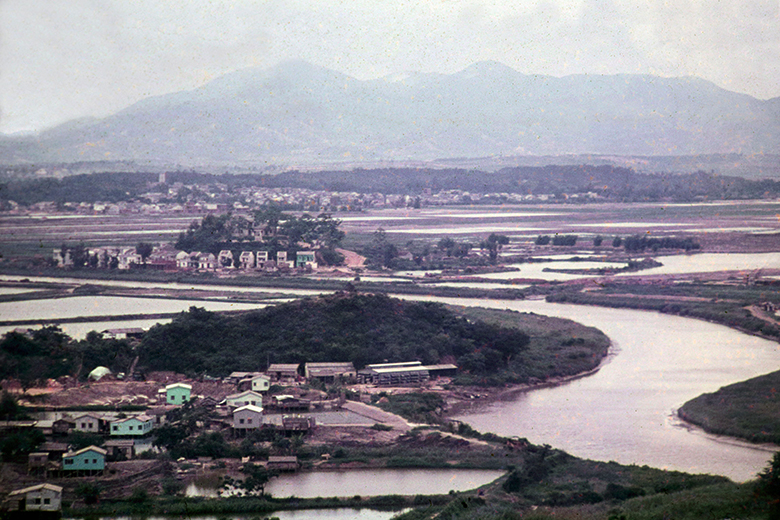 iew from Lok Ma Chau Police Station in 1979, looking north into the People's Republic of China. Ha Wan Village (Hong Kong) is bottom left, the fields beyond the Shenzhen River in Guangdong Province, are where part of the megacity of Shenzhen now stands. iew from Lok Ma Chau Police Station in 1979, looking north into the People's Republic of China. Ha Wan Village (Hong Kong) is bottom left, the fields beyond the Shenzhen River in Guangdong Province, are where part of the megacity of Shenzhen now stands.