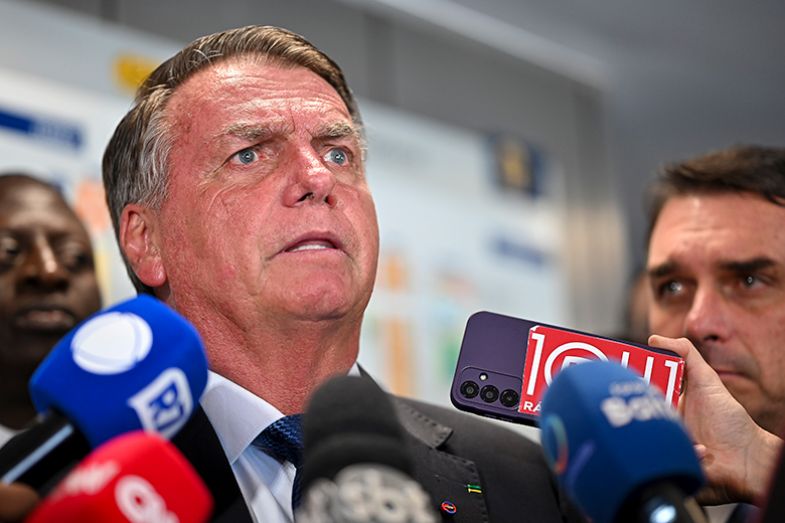 Former Brazil president Jair Bolsonaro talks to the press about the leave of absence of his son Eduardo Bolsonaro, a member of the federal parliament, and the trial in the Supreme Court regarding the coup plot, in Brazil, on 18 March 2025.