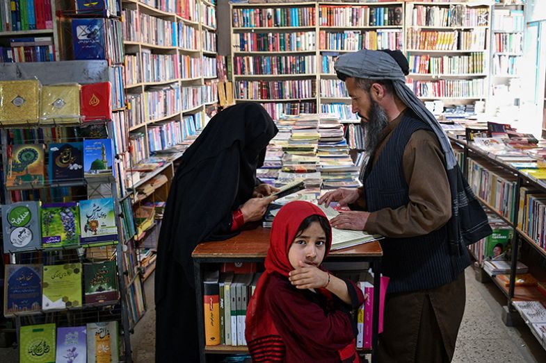 An Afghan woman browses a book at a bookstore in Mazar-i-Sharif, Afghanistan on 27 April 2025. An Afghan woman browses a book at a bookstore in Mazar-i-Sharif, Afghanistan on 27 April 2025.