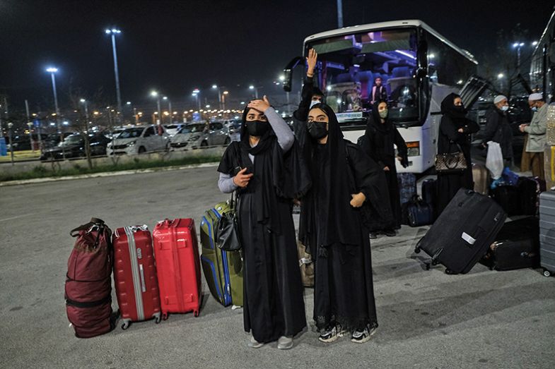 Afghan refugees board buses bound for temporary housing after arriving at Thessaloniki International Airport Afghan refugees board buses bound for temporary housing after arriving at Thessaloniki International Airport