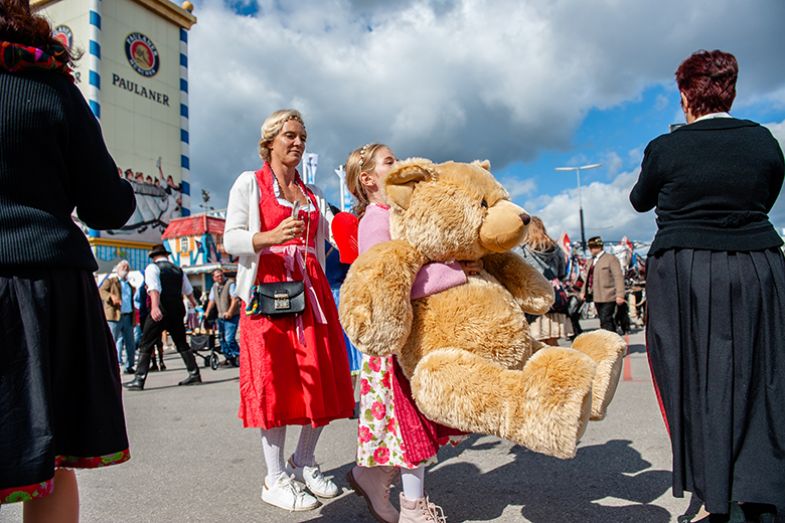 A girl holding a giant teddy bear prize at Oktoberfest in Munich, Germany. As an illustration of the huge funding prizes on offer to a select few institutions chosen in excellence initiatives. A girl holding a giant teddy bear prize at Oktoberfest in Munich, Germany. As an illustration of the huge funding prizes on offer to a select few institutions chosen in excellence initiatives.