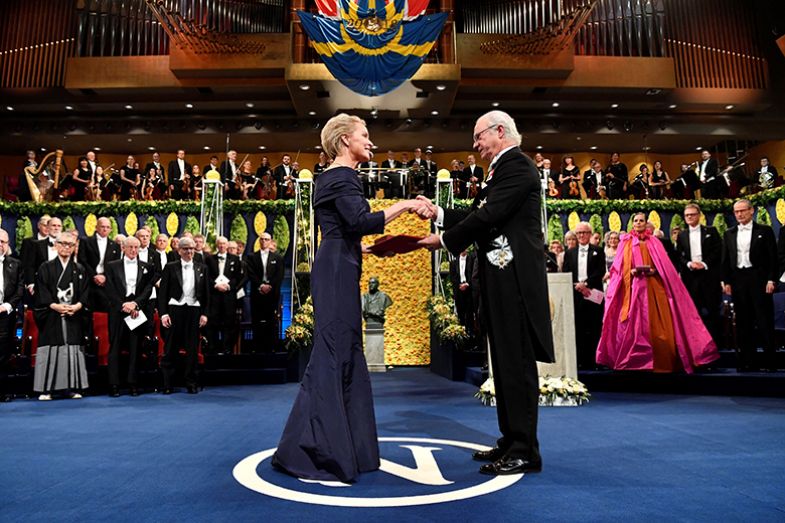 Co-laureate of the 2018 Nobel Prize in Chemistry US chemical engineer Frances Arnold receives her Nobel prize from King Carl XVI Gustaf of Sweden (R) during the award ceremony on 10 December 2018 at the Concert Hall in Stockholm, Sweden
