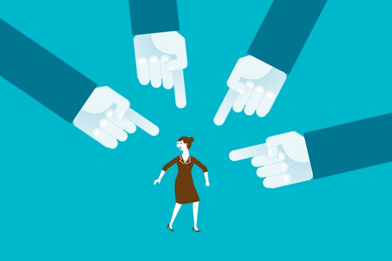 Woman with large hands pointing at her. To illustrate that academics are inclined to perceive bullying much more frequently than they once did. Woman with large hands pointing at her. To illustrate that academics are inclined to perceive bullying much more frequently than they once did.