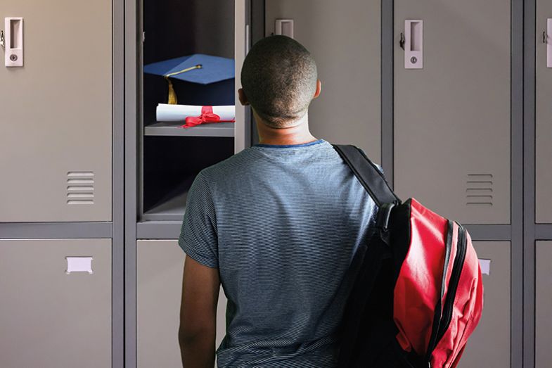 High school student in front of a locker