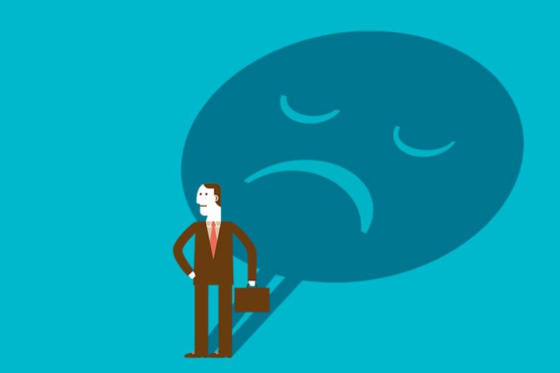 Man with a large unhappy shadow. To illustrate the increase in formal complaints at UK universities. Man with a large unhappy shadow. To illustrate the increase in formal complaints at UK universities.