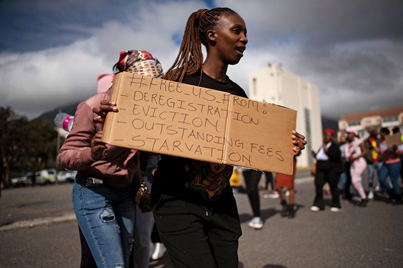 Students from various tertiary education institutions protest over funding grievances and the new student allowance payment methods, outside the offices of the National Student Financial Aid Scheme (NSFAS) in Cape Town, South Africa on 24 May 2023. Students from various tertiary education institutions protest over funding grievances and the new student allowance payment methods, outside the offices of the National Student Financial Aid Scheme (NSFAS) in Cape Town, South Africa on 24 May 2023.
