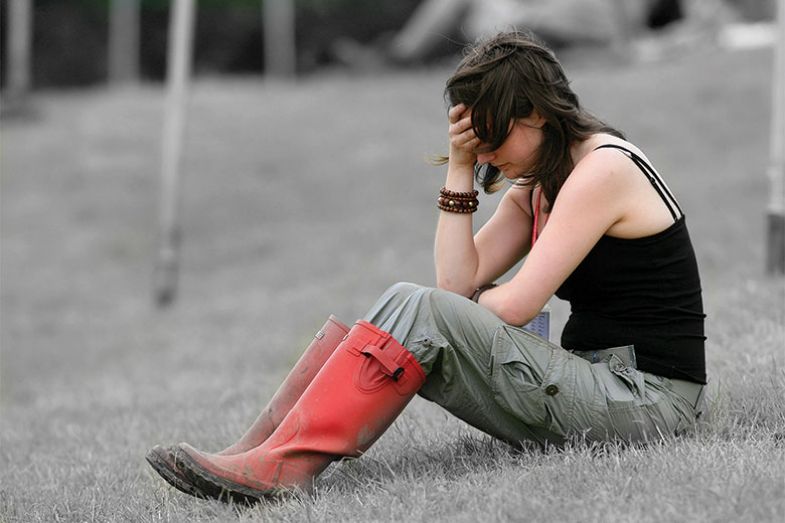 Woman with head in hand Woman with head in hand