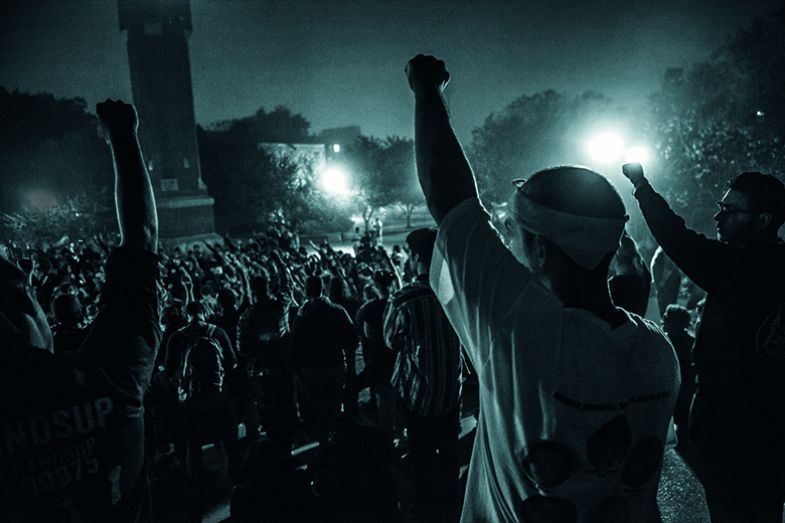 Protesters raise their fists at St Louis University