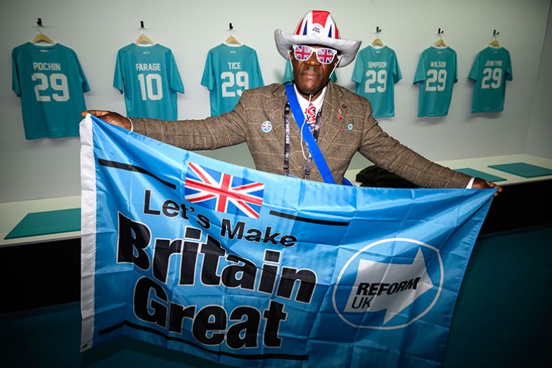 A Reform UK supporter in a Union Jack-themed outfit at the party’s annual conference at the National Exhibition Centre in Birmingham