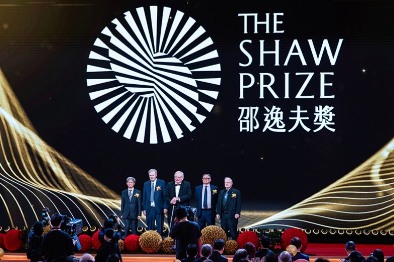 Reinhard Genzel (C), chair of the Board of Adjudicators of the Shaw Prize Foundation, poses for a group photo with this year’s laureates at the Grand Hall of the Hong Kong Convention and Exhibition Centre on 21 October 2025 in Hong Kong, China. 