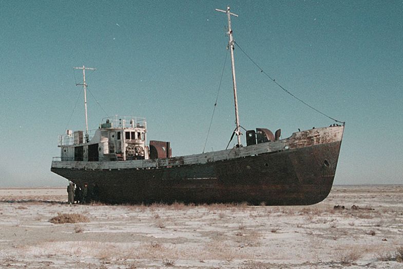 An abandoned fishing vessel in the Aral Sea, 1999. The Aral Sea is an inland sea, east of the Caspian Sea, mainly in Kazakhstan. The diversion of water from rivers supplying the sea for cotton irrigation projects has upset the ecological balance.
