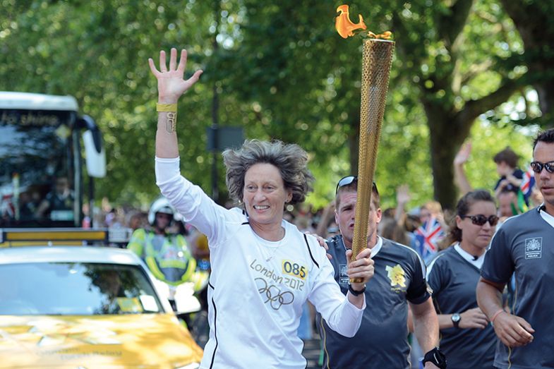 Sarah Springman carries the Olympic flame during the London 2012 Olympic Torch relay