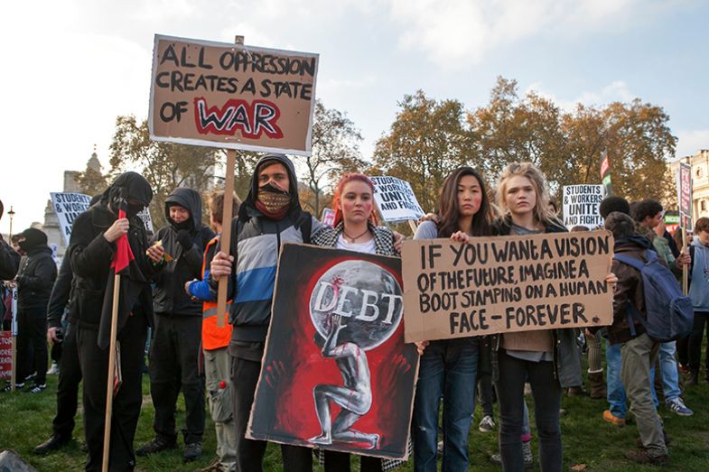 Students protest against fees and cuts and debt in central London, UK, 2016.