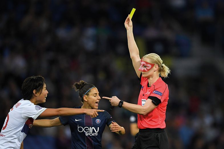 Referee giving yellow card