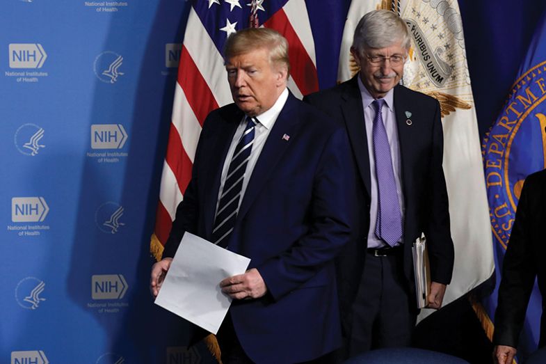 Donald Trump arrives at a coronavirus roundtable briefing at NIH’s Vaccine Research Center in Bethesda, Maryland in March 2020. At right is Francis Collins