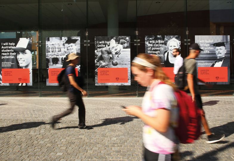 Students walk around Sydney University