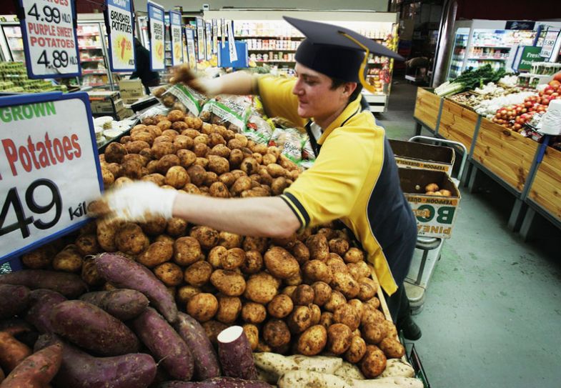 Montage of a supermarket employee stacks potatoes wearing a mortar board and graduation cloak
