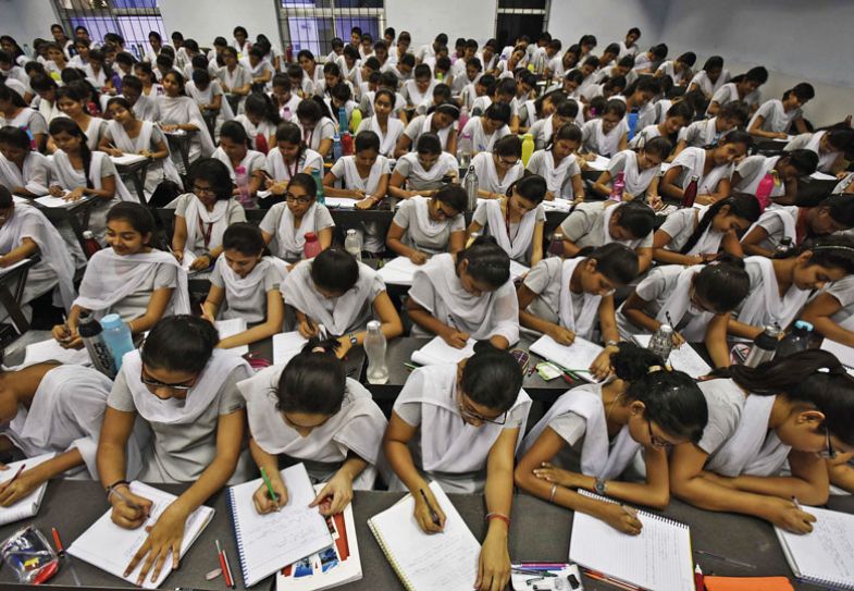 Students take notes at Allen Career Institute, India