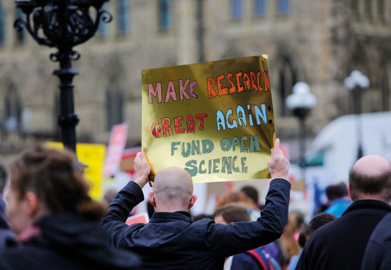 A demonstrator holds a sign during the March for Science rally 