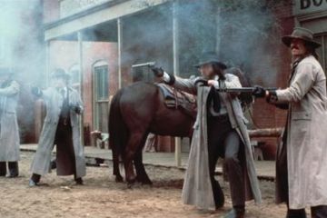 Gunslingers/cowboys fire their guns