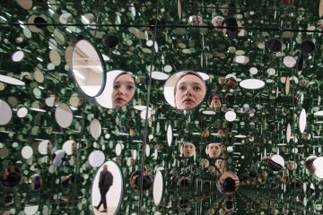 Face repeated in series of mirrors Face repeated in series of mirrors