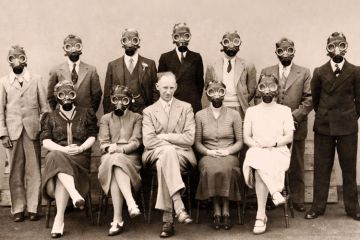 A group of people wearing gas masks