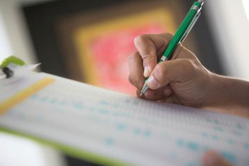 A pen and a clipboard A pen and a clipboard