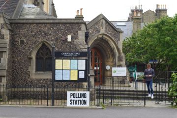 A 2017 polling station in Hove with a voter leaving after voting.