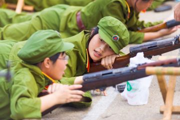 A Chinese female university student during compulsory university military training A Chinese female university student during compulsory university military training