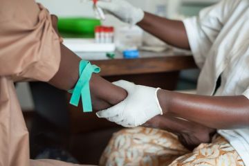 Nurse taking blood in Africa 