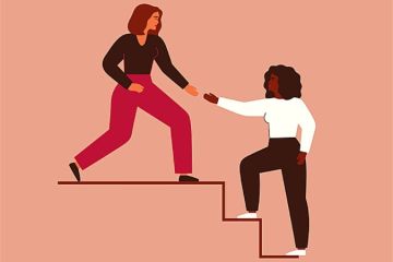 A woman reaches down to help a colleague up the stairs, illustrating allyship