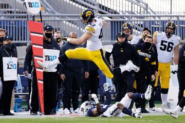 Shaun Beyer of the Iowa Hawkeyes leaps over Lamont Wade of the Penn State Nittany Lions Shaun Beyer of the Iowa Hawkeyes leaps over Lamont Wade of the Penn State Nittany Lions to illustrate Gambling threat ‘rising on US campuses’