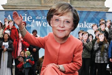 Some 350 demonstrators, wearing masks of German Chancellor Angela Merkel, take part in the “Looking for a climate chancellor” protest, 2009