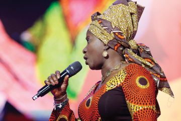 Angélique Kidjo singing on stage