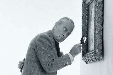 Art critic examining painting Art critic examining painting
